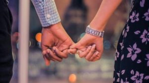 A couple holding hands